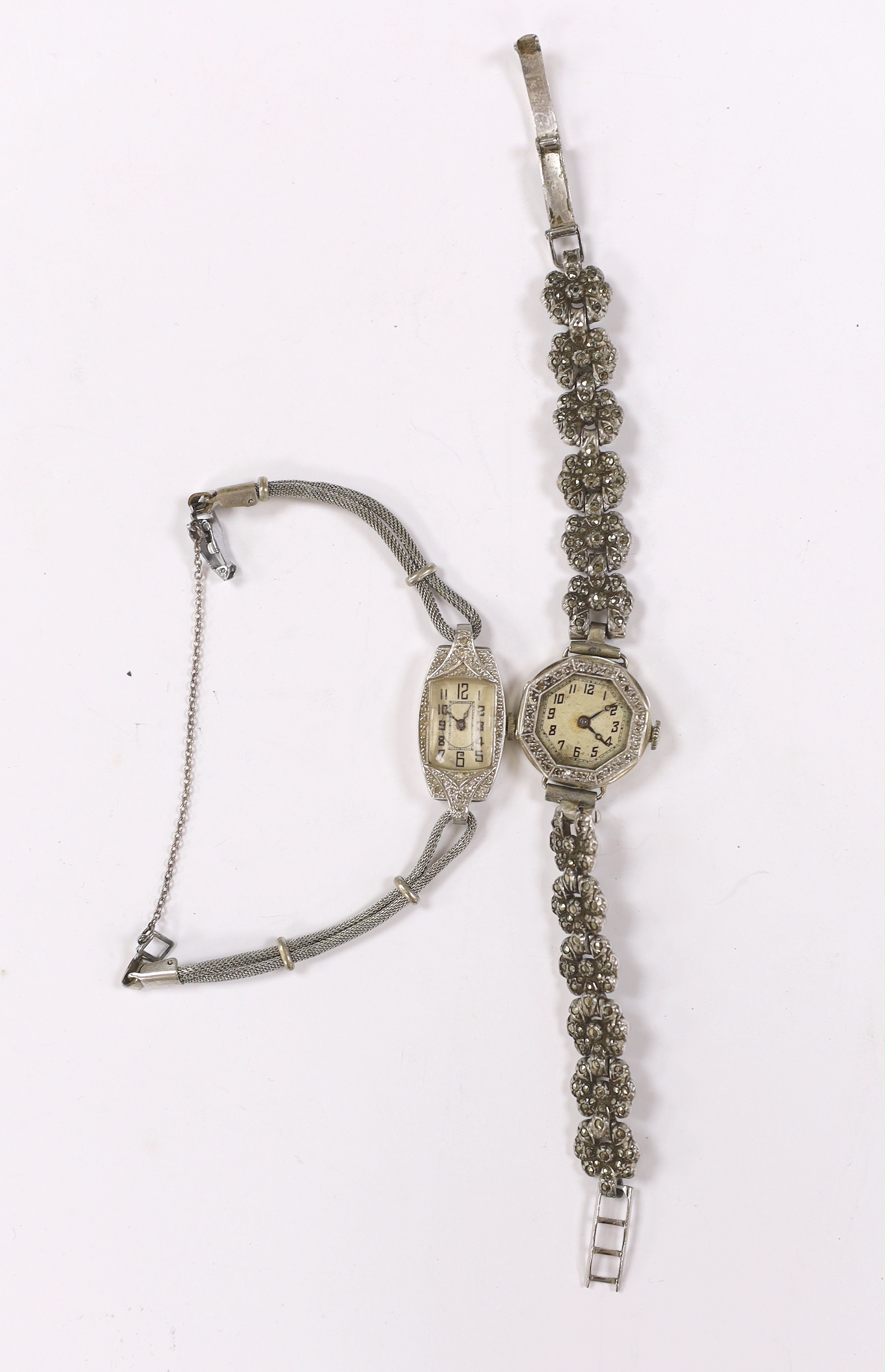 A lady's 18k and diamond set manual wind octagonal cocktail watch, a marcasite set steel bracelet and one other white metal and diamond chip set cocktail watch on a steel mesh bracelet.